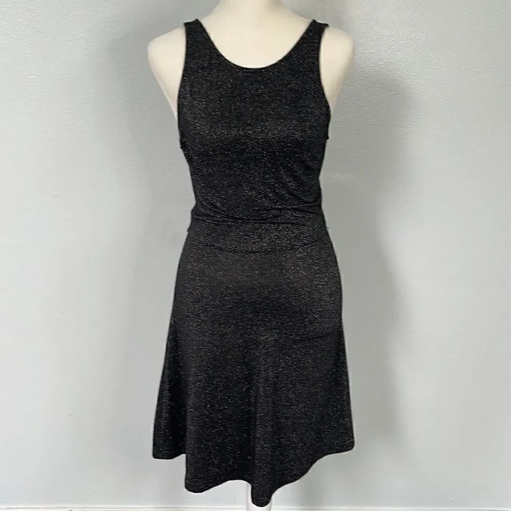 Divided little black dress.  Size 4. Lots of sparkle!